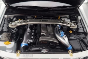 Nissan Skyline GT-R R34 Nismo Z-Tune Valge MotorHelix 1:18 M83407 Metall - pilt 9/11