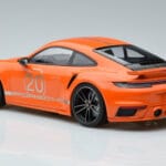 Porsche 911 992 Turbo S China 20th Anniversary Oranž Minichamps 1:18 - image 5 of 6
